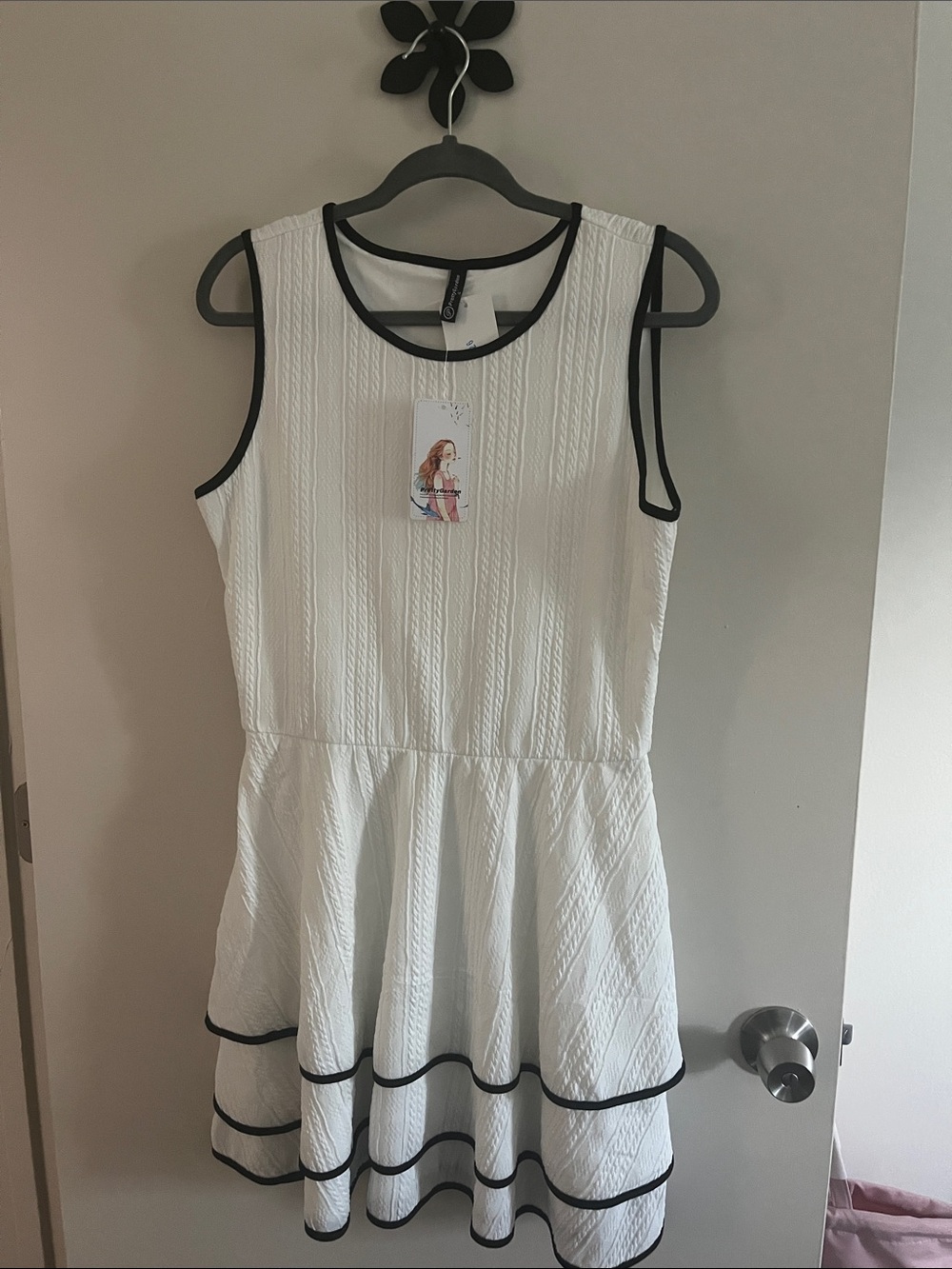 Sleeveless White Textured Fit-and-Flare Dress with Black Trim
